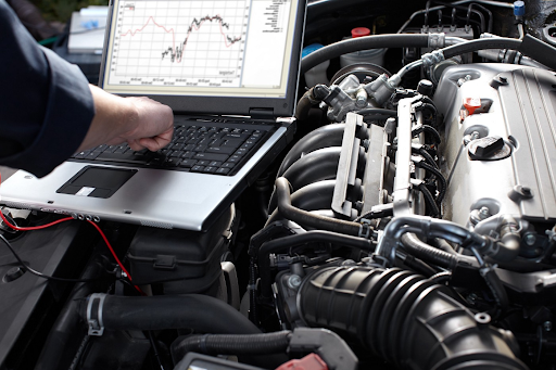 Diesel mechanic carrying out diagnostic testing on a commercial truck